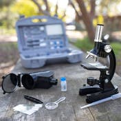 The GeoSafari® MicroPro™ Microscope on a table outside.
