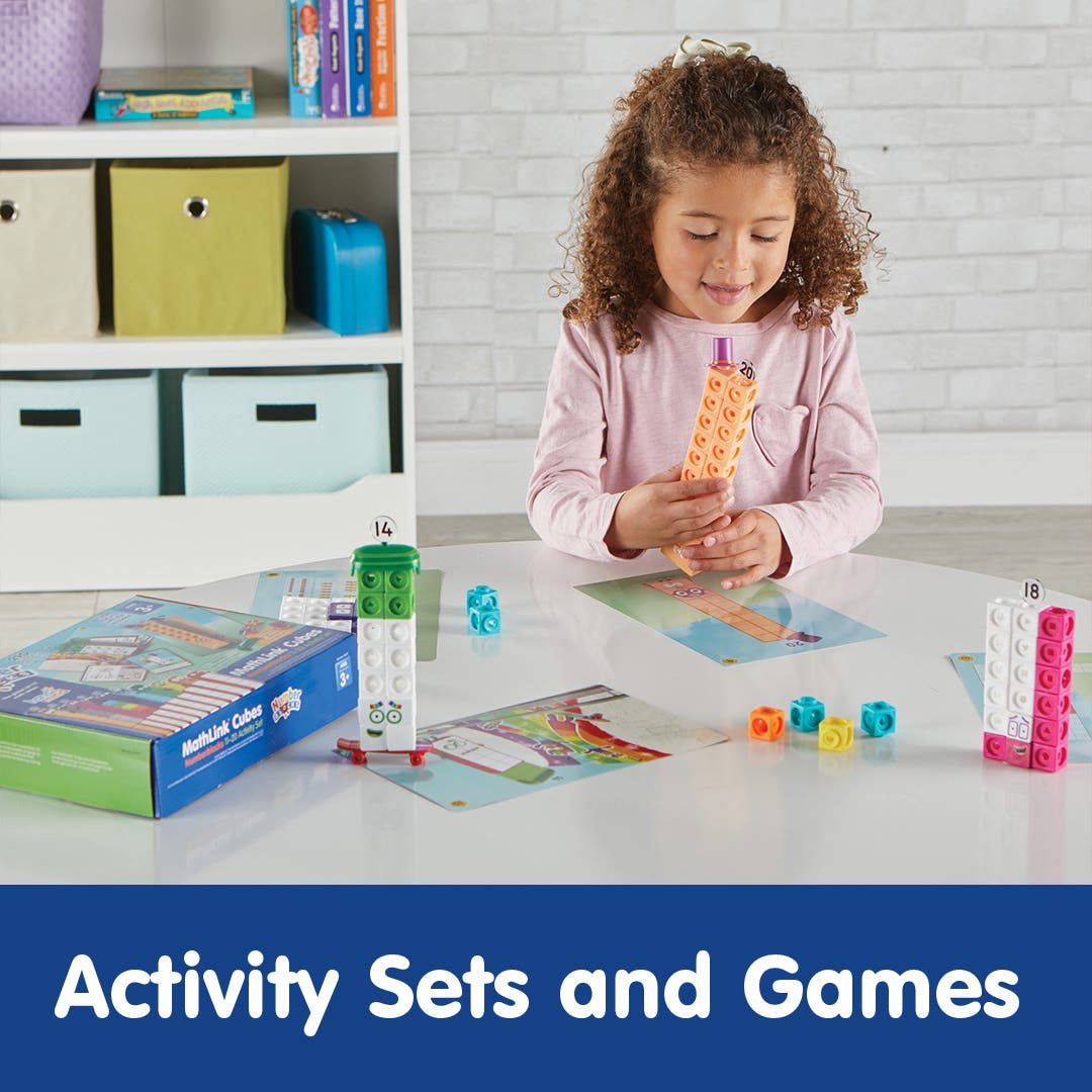 girl playing with colorful activity sets on a table
